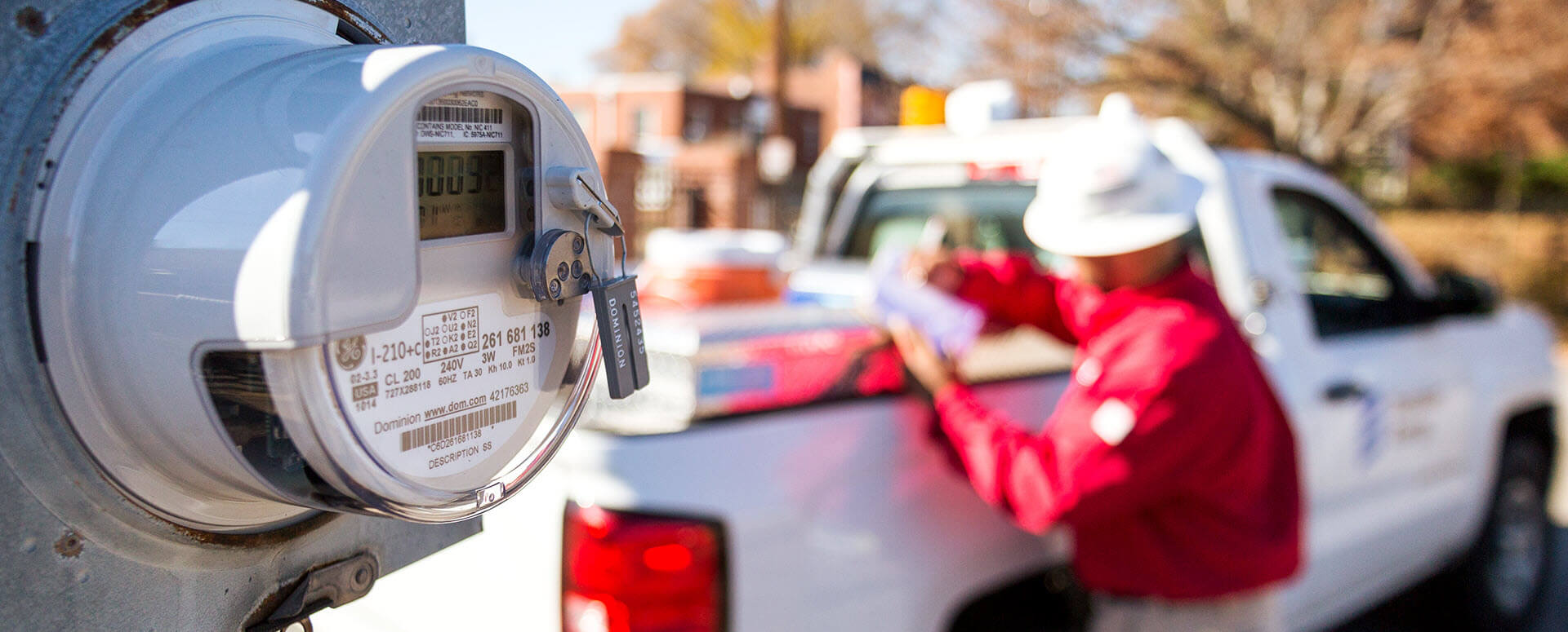 smart meter and a worker in the background