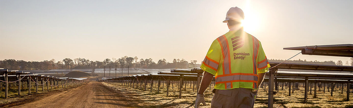 Dominion Energy Employee Walking in Solar Field