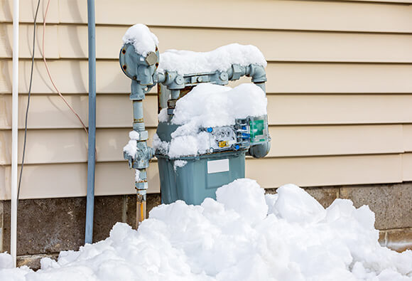 Natural Gas Meters Covered With Snow and Ice