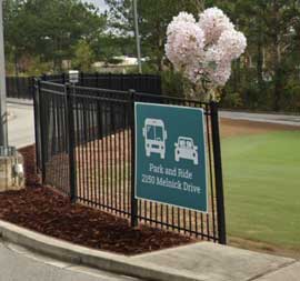 Park and Ride sign on a fence