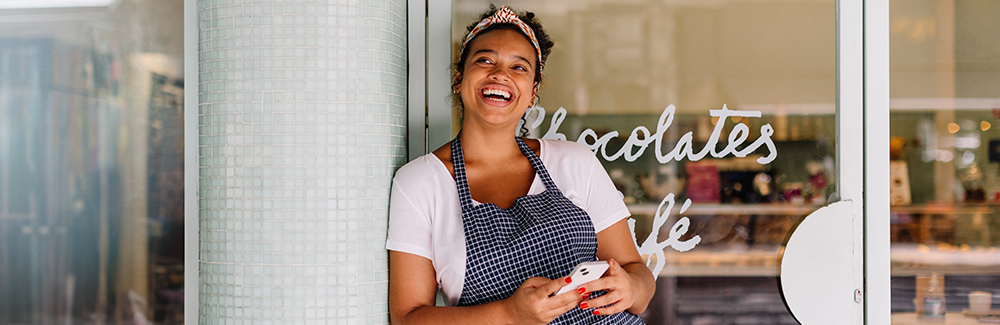 Image of girl standing in front of cafe