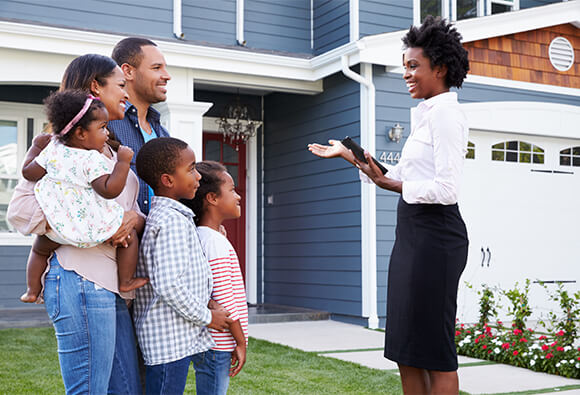 Property Manager Showing Family a House