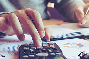 Man Using Calculator